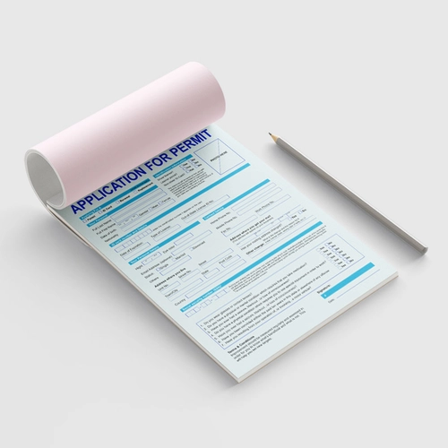 A large display of NCR forms showing multiple sheets, designed for efficient record-keeping and carbonless copy functionality