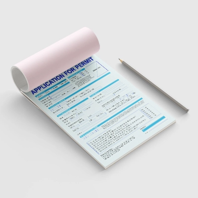 Close-up of NCR forms showcasing their multi-part design.